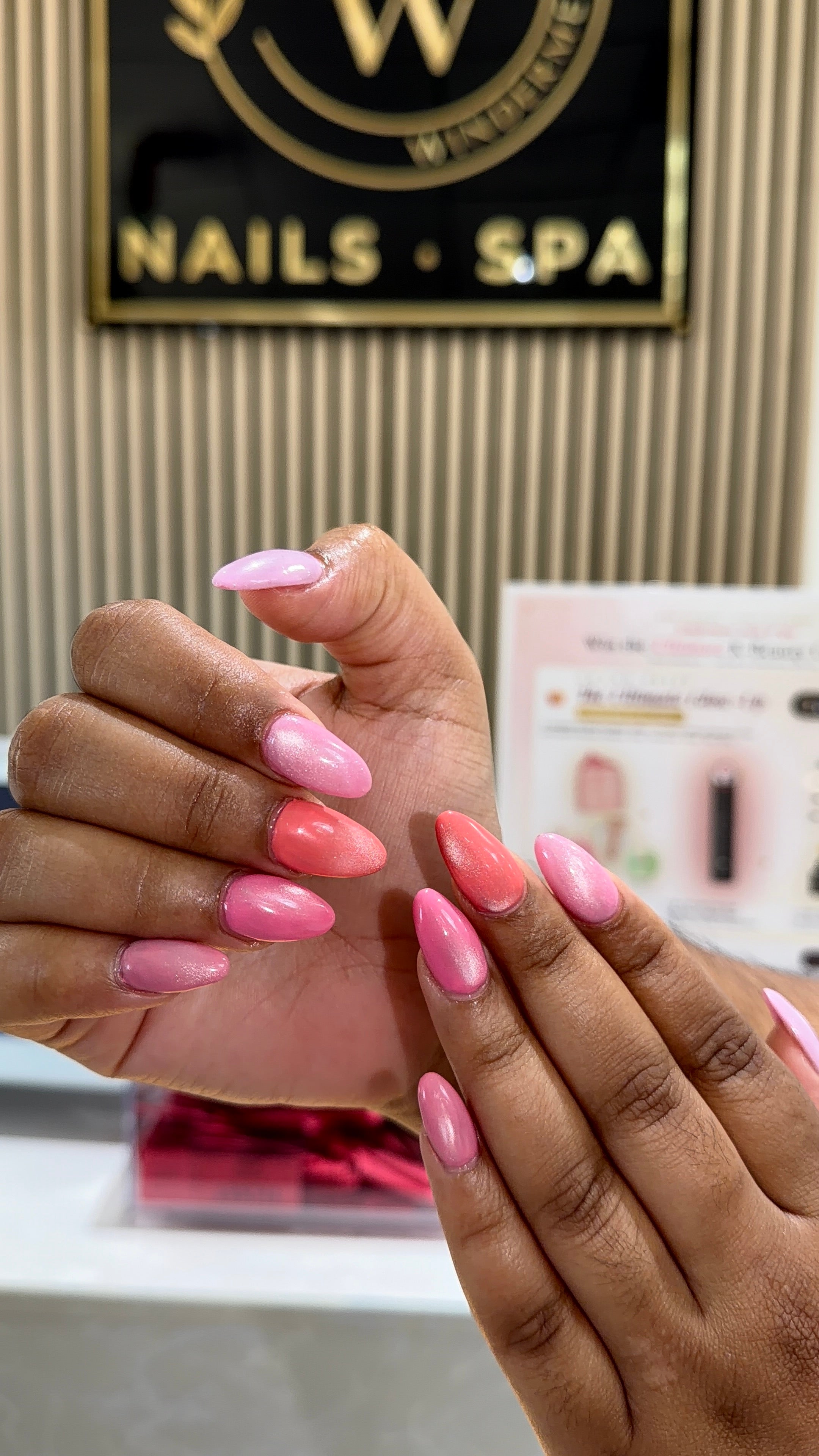 Pink and coral nail design in Cumming, GA